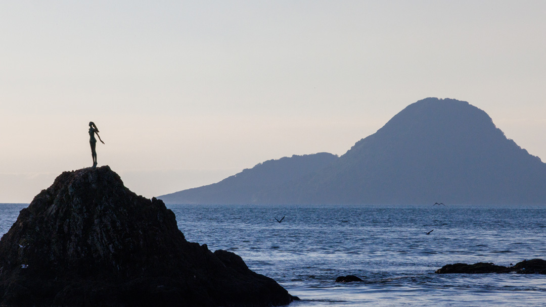 Wairaka statue at Whakatane, ocean at sunset